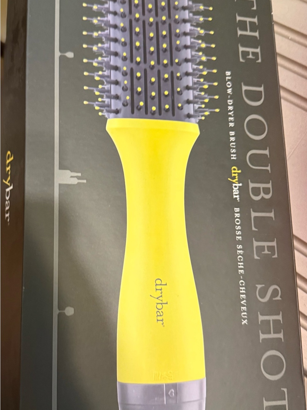 Drybar yellow handle blow-dryer brush with lavender bristles